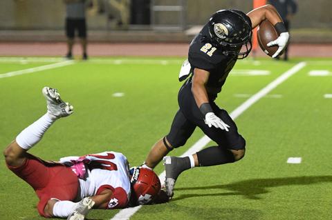 Kaden Crooks (21) leaves the defender on the turf en route to a touchdown