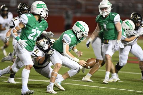 Tripp Mills (61) forces a fumble on Wall quarterback Gunnar Dillard, for a big turnover in Canadian's state quarterfinal victory.