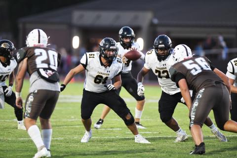 Tripp Mills (61) and Javier Cardenas (73) protect Wildcat quarterback Camren Cavalier's blind side.