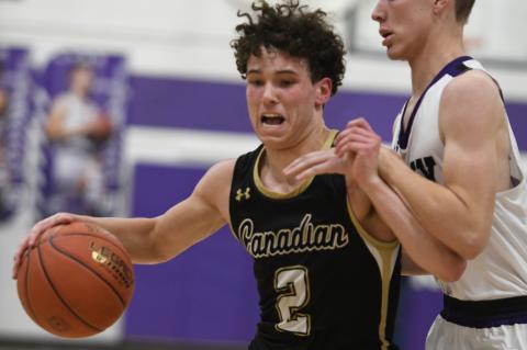 Trace Mitchell (2) outmuscles the Lynx defender at Spearman Tuesday night