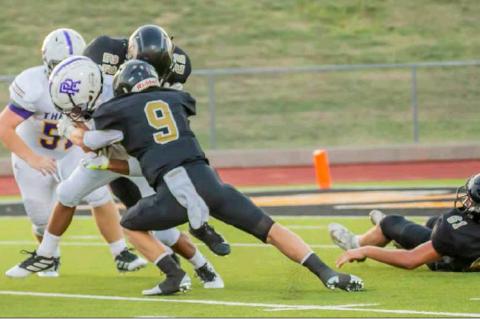 HIT PARADE: Meyer Ray Ancira (9) lowers his shoulder into River Road’s ball carrier, holding the visitors to no gain on the play.