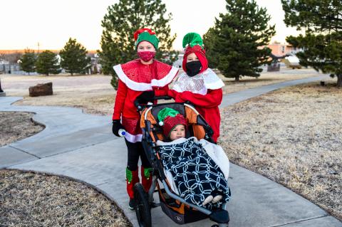 Maddy, Wyatt, and Doc Longoria prepare for Saturday morning's elf walk