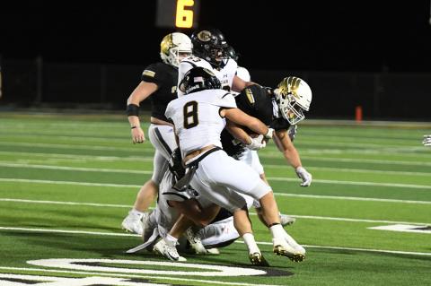 No. 8 Ethan Jackson and No. 63 Corbin Throgmorton drop this Falcon for a loss of yards.