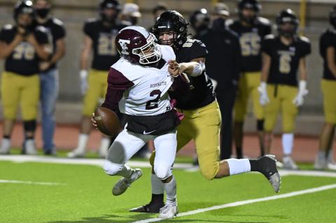 Colton Cooper (62) runs down the Hornet runner Brayden Franco