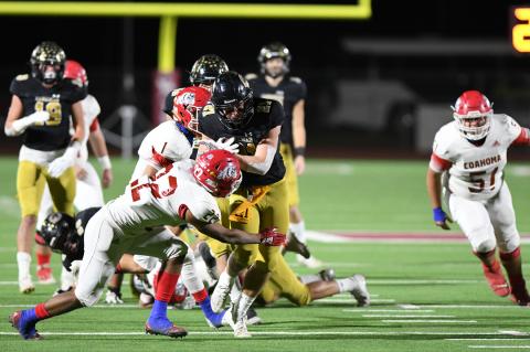 JAVIER CARDENAS (73) CLEARS THE WAY FOR HAYZE HUFSTEDLER (21) AS HE HEADS FOR THE END ZONE IN LAST FRIDAY’S BI-DISTRICT WIN OVER COAHOMA