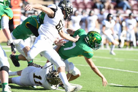 It was a rough night for Idalou's quarterbacks. At left, Everett Hadaway (11) and Colton Cooper (62) chase down senior Idalou quarterback Jared Jack (7).