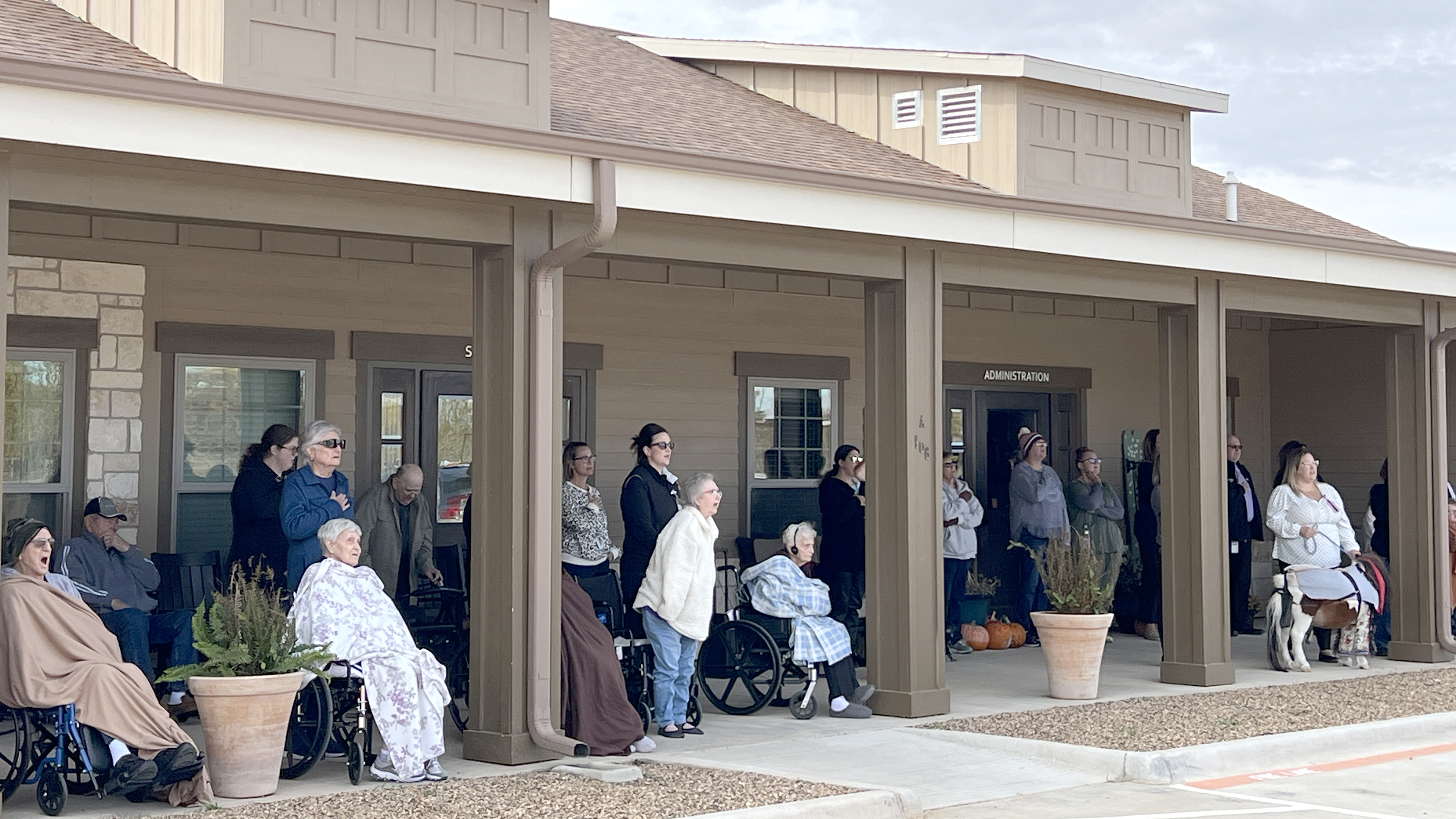 Mesa View residents, staff, friends and family attend the flag dedication ceremony
