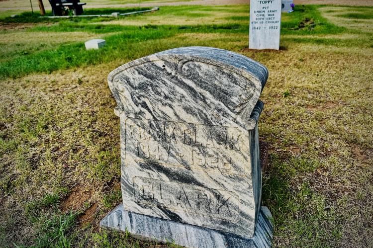 The original headstone on Frank "Toppy" Clark's grave