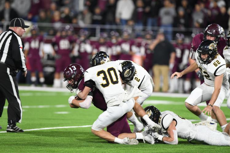 Quarterback Bryson Daily (#13) of the Abernathy Antelopes sees double trouble from Jack and Bill Koetting, who sack him for a loss as #62 Colton Risley and #21 Hayze Hufstedler (on the ground) lend a hand.