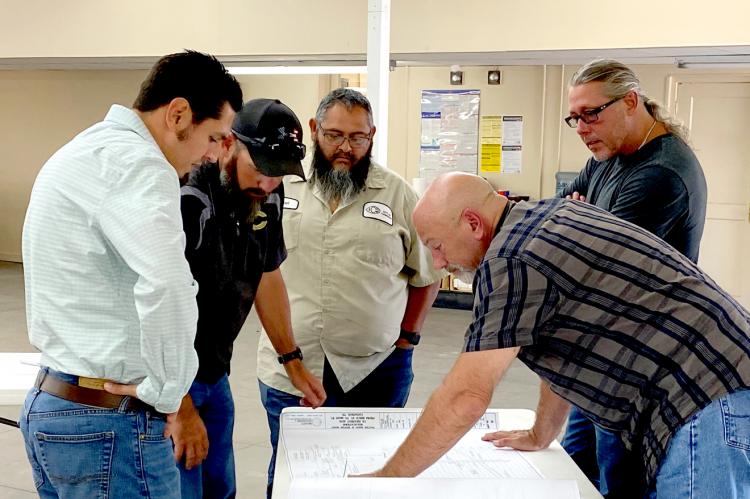 Making Plans Looking over the US 60 Utility Relocation Project plans at City Hall Thursday afternoon were (l-r) Adolfo Garcia, P.E., Brandt Engineers; Tommy Wyatt, public works director; Abel Lucero, water and wastewater superintendent; and Amarillo Utility Contractors representatives Monte Taylor, president, and Keith MacGregor, project manager. Also present for the meeting were City Manager Joe Jarosek and Mayor Terrill Bartlett. 