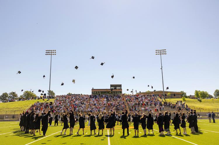 The CHS Class of '24 tosses their caps in the air following Saturday graduation ceremony