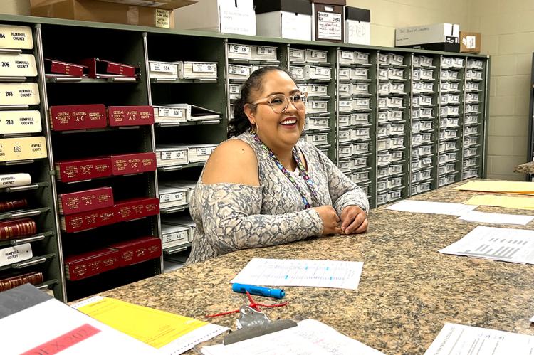 Rosa Gandara assists County Clerk Sylvia Guerrero with the ballot count