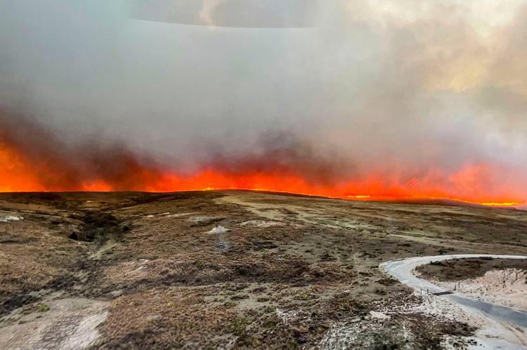 Flap-Air Helicopter Service’s Trey Webb provided aerial support to firefighters, while son Emmett Webb captured panoramic shots like this one of the fire line that stretched as far as the eye could see through southern Hemphill County Tuesday afternoon