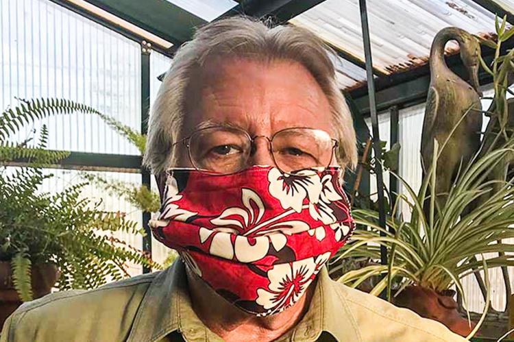 Mike McKinney wearing a handmade mask by his wife, Kim.