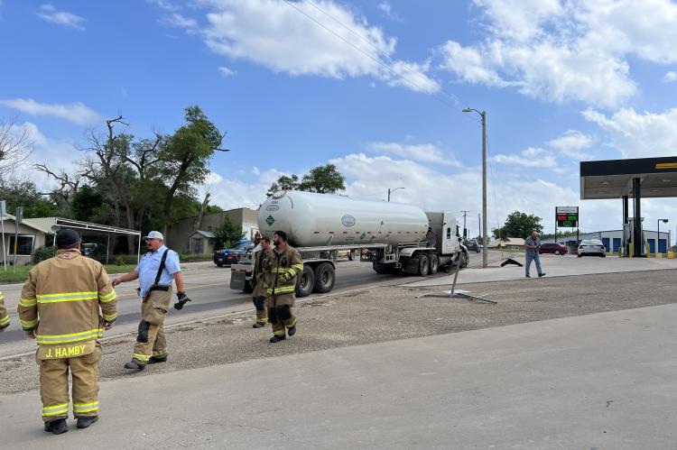 This Peterbilt semi was hauling anhydrous ammonia when it struck a pickup that had slowed to turn into Dollar General parking lot