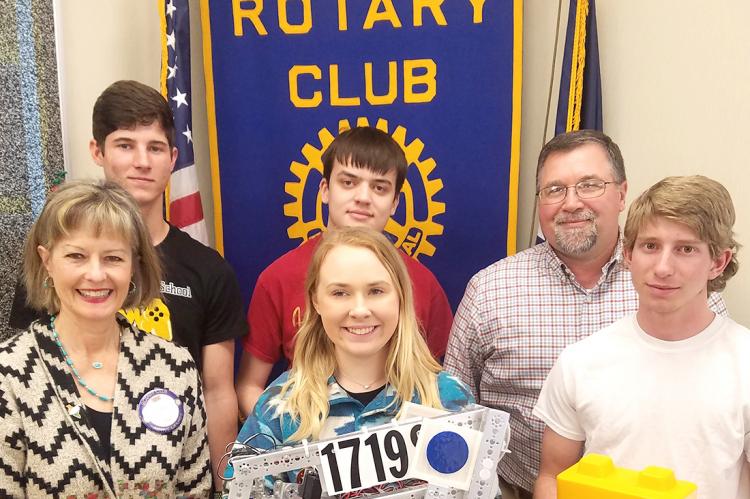 CHS Robocats with Rotarian Beth Briant and their coach, Bruce Bryant