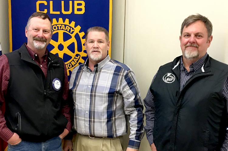 Rotary member Curt McPherson and his guests from PTCI, Travis Clark (middle), and Deblin Frances (at right)