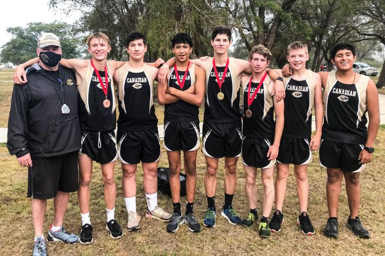 Wildcat Varsity Cross Country runners Cade Dunbar, Blaine Campbell, Ivan Robledo, Rylun Clark, Ethan Flowers, Anderson Perkins and Lino Lugo, with Coach Jay McCook. PHOTO BY PENNY CLARK