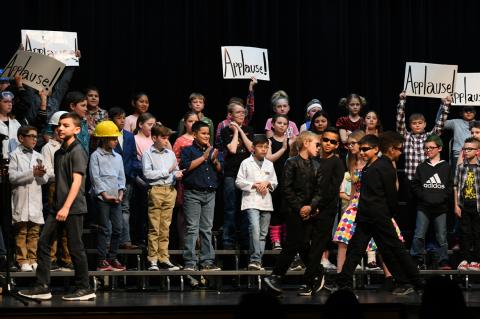 It was no trouble rousing the audience at the Texas Crown Performance Hall Monday morning, but the Applause! cards were still pretty amusing, and yielded their share of laughs in this performance of "Matter and Its Properties" by the BES fourth-graders.