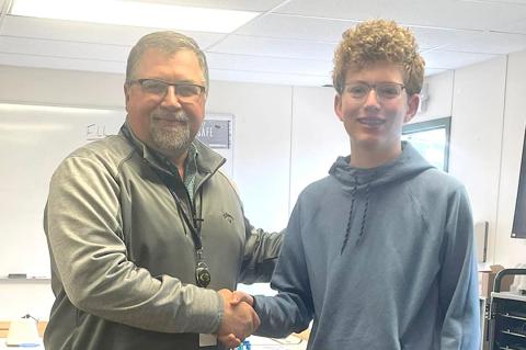 CHS computer sciences and robotics instructor Bruce Bryant is congratulated by his student, Tate Wilhelm, who nominated him for the Mrs Baird’s Teacher on the Rise Award.