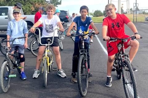 Cyclists Colby Shrader, Campbell Spence, Dante Green, and Cason Bundy at the starting line Saturday.