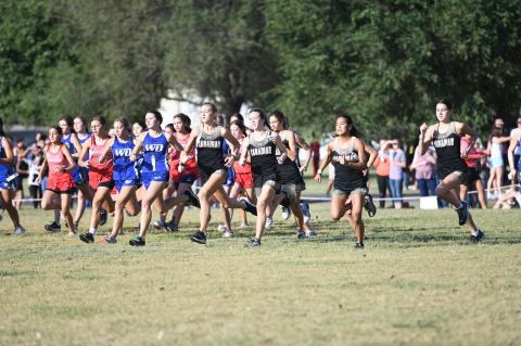Canadian’s Lady Cats led at from the start (photo at top) of Saturday’s Cross-Country Invitational and crossed the finish with three in the top 10