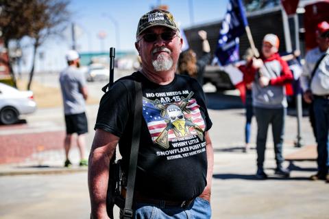 Dewayne Ford stands in protest outside Beto campaign stop Saturday