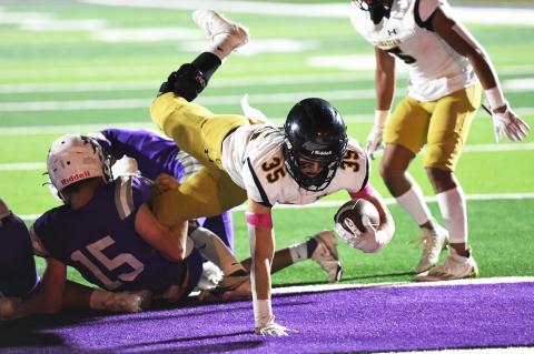 In Friday's comeback from the injured list, Luke Flowers (35) dives for the touchdown—one of eight carries for 116 yards on the night