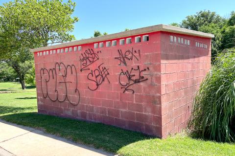 The vandals made their rounds of Canadian, leaving this graffiti on the exterior walls of the Jackson Park bathrooms, and on traffic signs, dumpsters, and other structures.