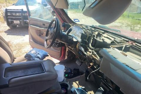Damaged interior of vehicle stolen in Canadian Saturday