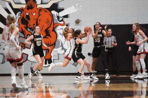 Kennedi Cook (00) and Mattie Boyd (55) watch as their teammate Tinley Pennington (20) fights for the rebound from Shallowater's Bree Brattain (23)