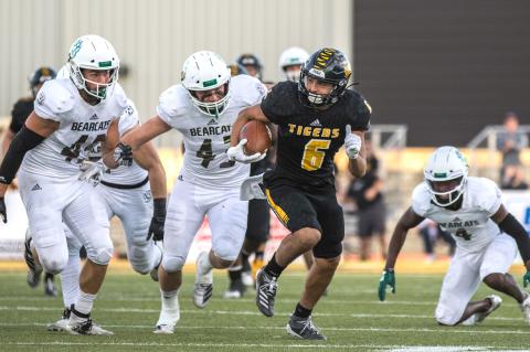 In 2017, Manny Ramsey traded in his Wildcat black and gold for the Hays State Tigers’ black and gold. In this photo, by Allie Schweizer, Ramsey (No. 6) pulls down a pass and scrambles for yardage, a skill that has earned him first-team wide receiver honors on the Mid-American Intercollegiate Athletics Association All-Conference Team during his final year of collegiate play.