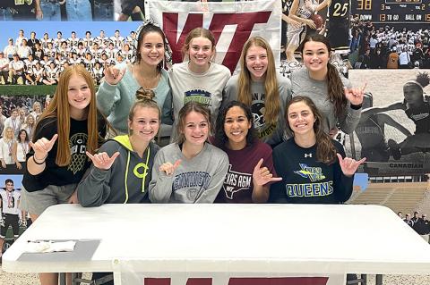 Mattie Boyd is surrounded by her Lady Cat teammates at this week's signing