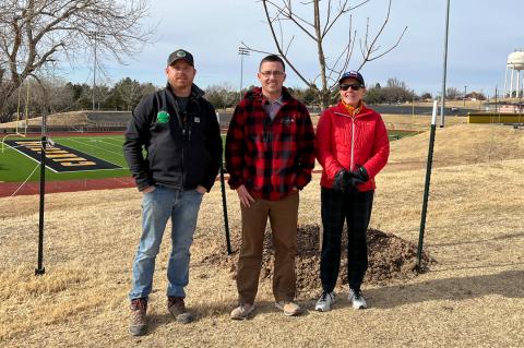 Hutch Reed, Charlie Mann, and Kathy Dumbauld survey the newly-planted trees at Wildcat Stadium last Friday